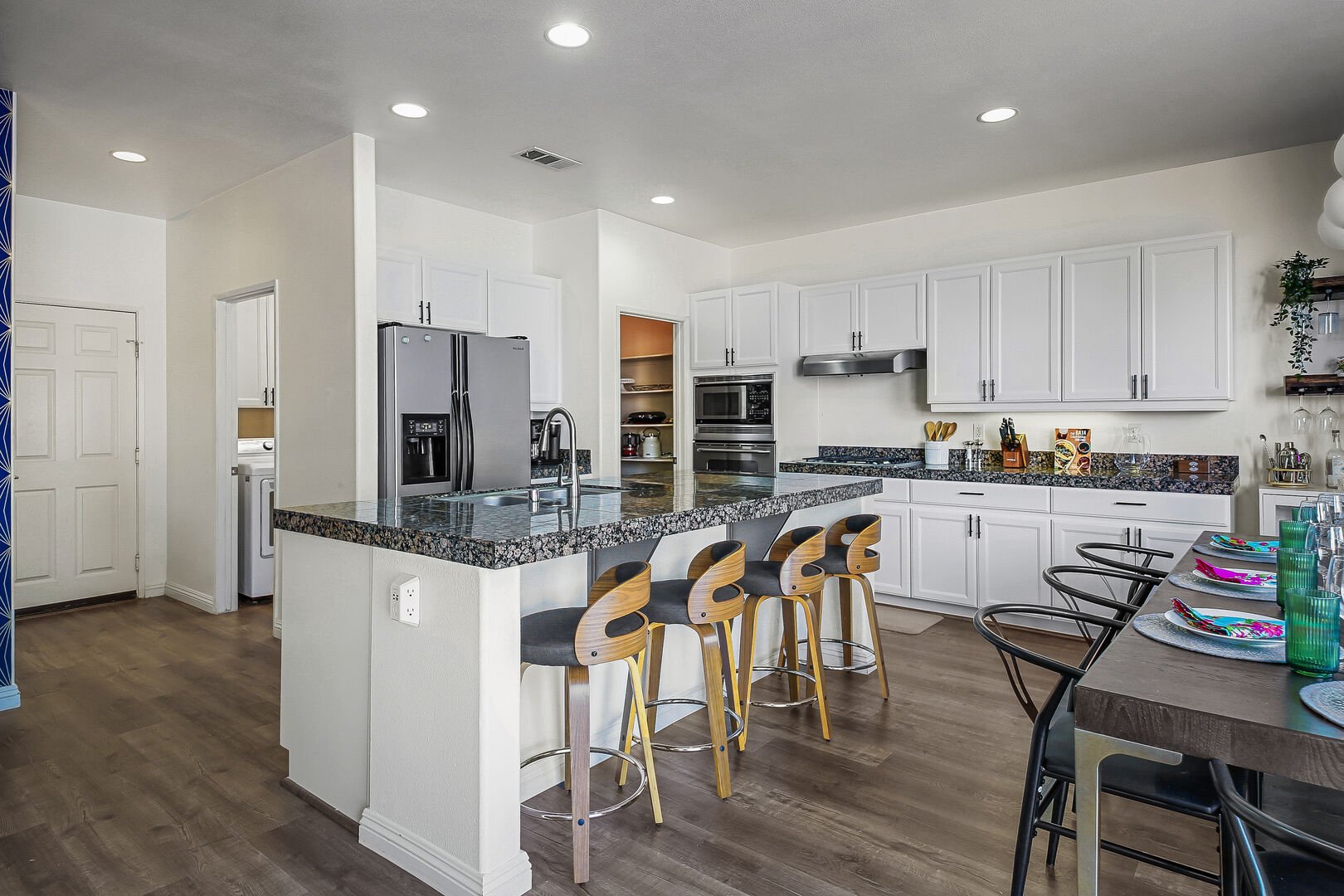 The fully-equipped kitchen features stunning stainless steel appliances.