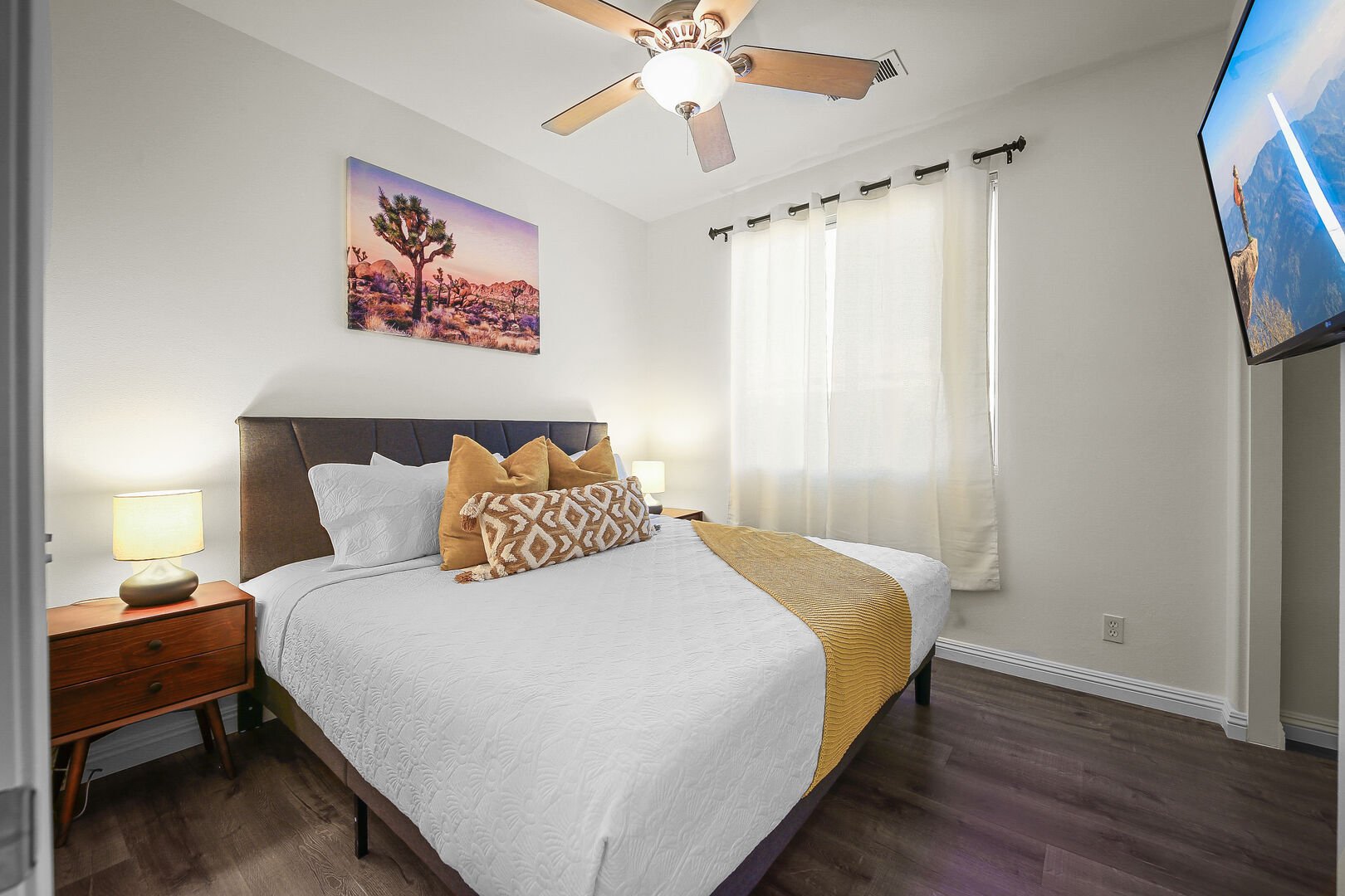 Bedroom 2 features a King-sized Bed, 44-inch LG Smart television, switch-controlled ceiling fan, and reach-in closet.