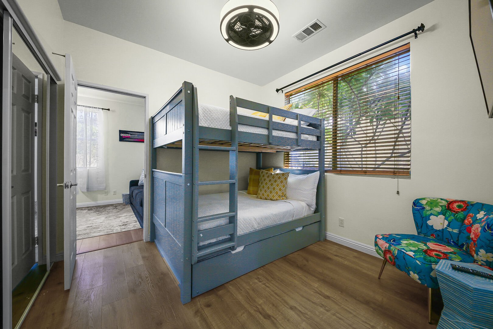 Bedroom 4 features a Full Over Full with Twin Trundle Bunk Bed, 44-inch LG Smart television, remote-controlled ceiling fan, and reach-in closet.