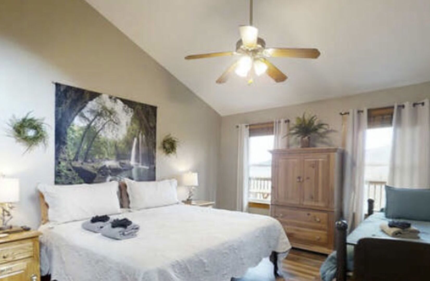 Enjoy a ceiling fan, an air cleaner and a flat screen TV in this bedroom.