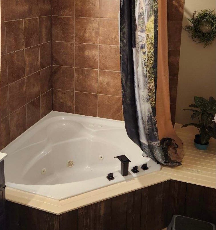 You can relax after a hard days play in the Jacuzzi tub & be able to rinse off with the hand held shower.