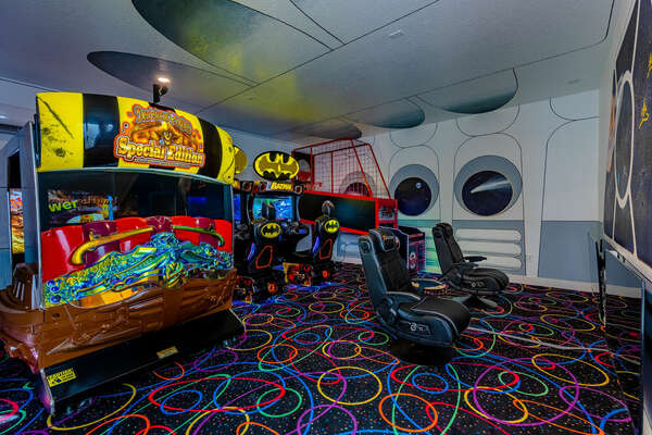 The garage arcade room features professional arcade games, including Batman riders, Pirates riders, and a basketball game, in addition to Xbox and PS5 gaming systems.