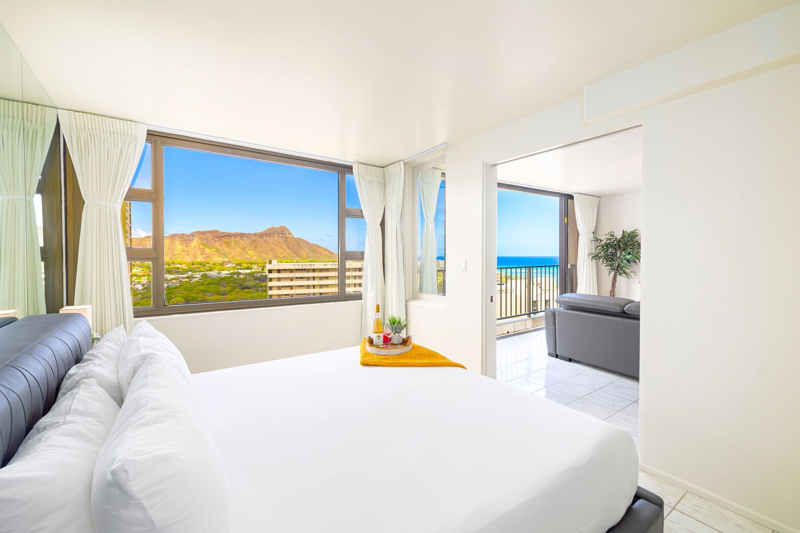 Relax in the bedroom with a king-size bed and beautiful ocean and diamond-head views. It also has a sliding door that separates from the living room for your privacy.