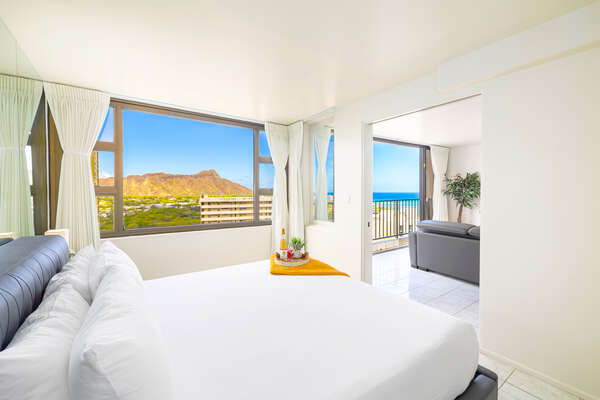 Relax in the bedroom with a king-size bed and beautiful ocean and diamond-head views. It also has a sliding door that separates from the living room for your privacy.