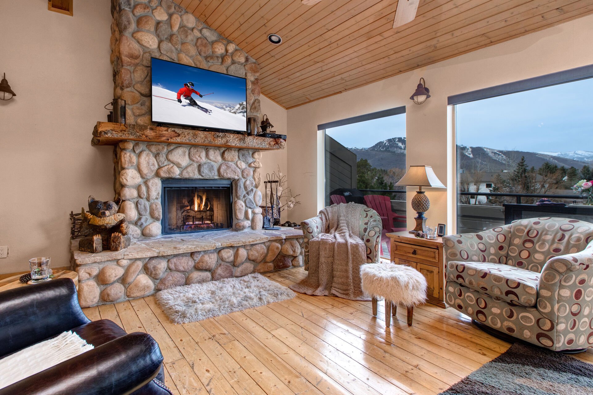 Main Living Room with a wood-burning fireplace, smart tv, and fabulous mountain views
