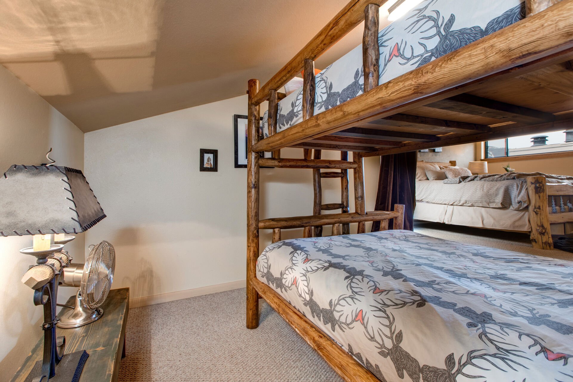 Upper Level Master Suite with king bed, twin over queen bunk, TV, walk-in closet, and en suite bathroom