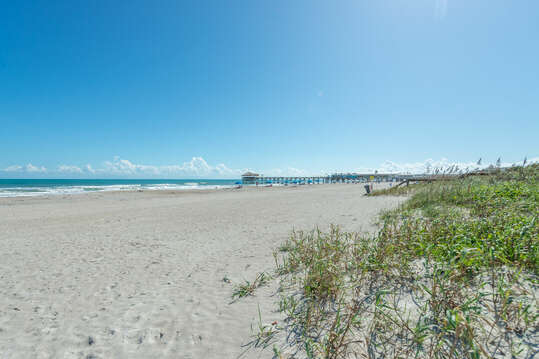 Your walk to the famous Cocoa Beach Pier from your private beach-access boardwalk