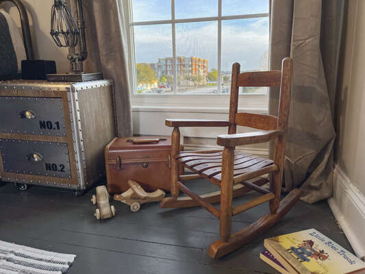 The kids will enjoy sitting in the vintage rocking chair reading books.