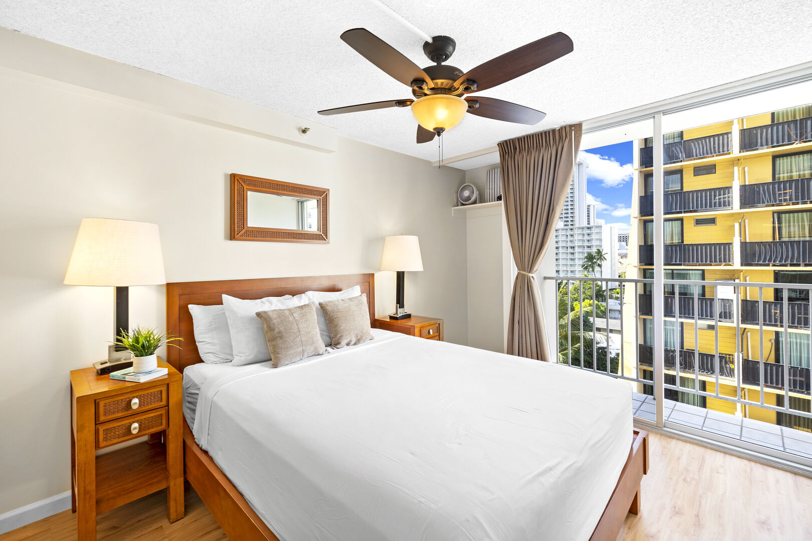 Relax in your bedroom with a queen-size bed, ceiling fan, nightstands, and blackout curtains.