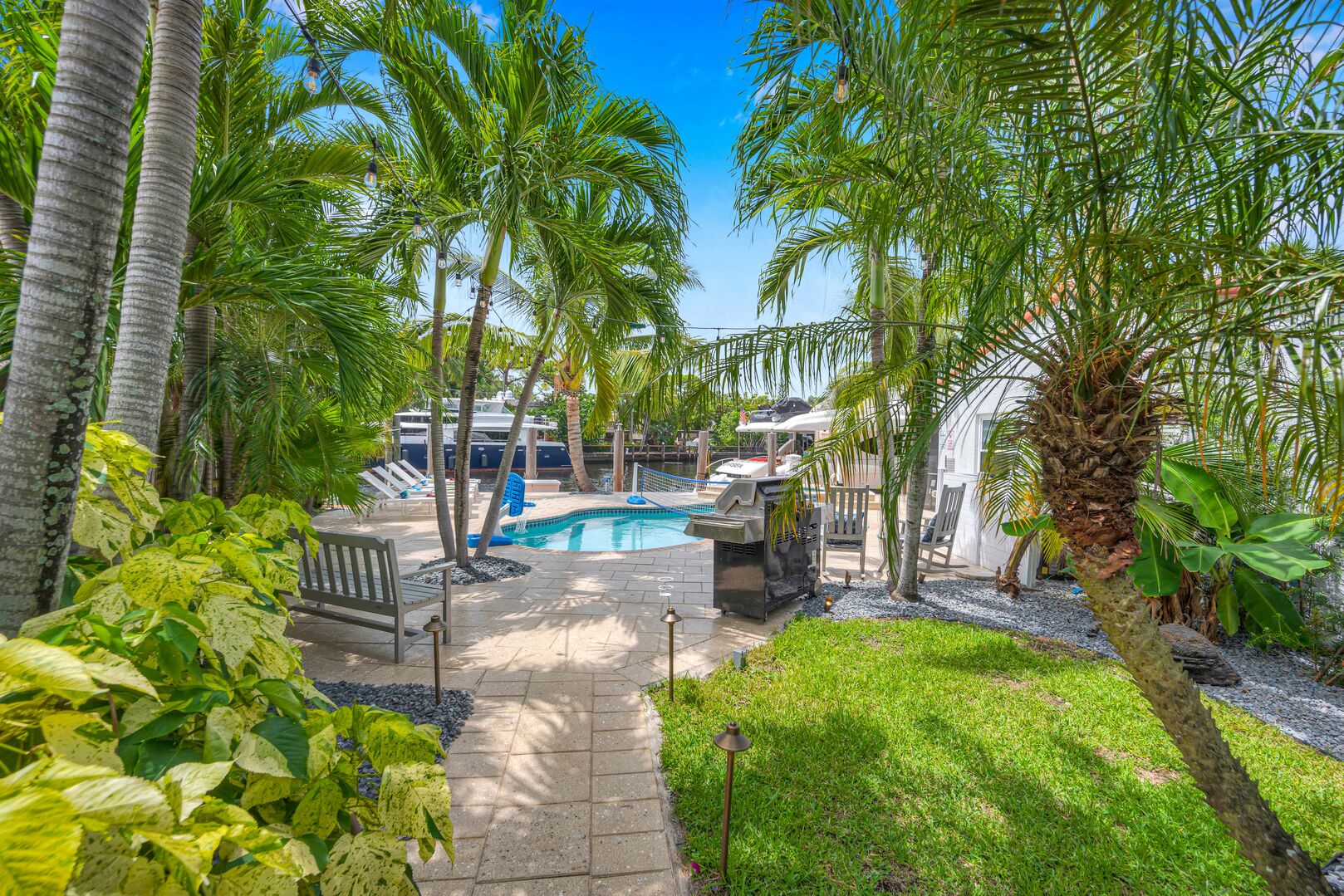 The luscious backyard is massive and really helps guests feel like they are in a tropical paradise!