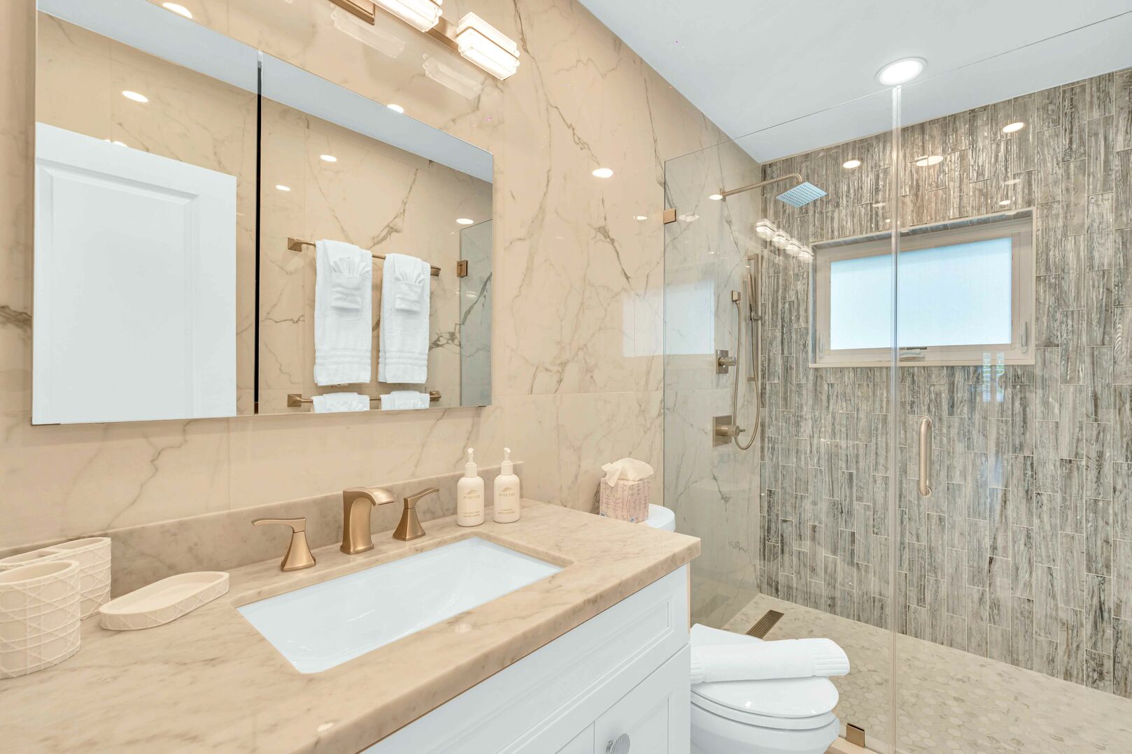 The bathroom between bedrooms 2 & 3 features a walk-in shower.