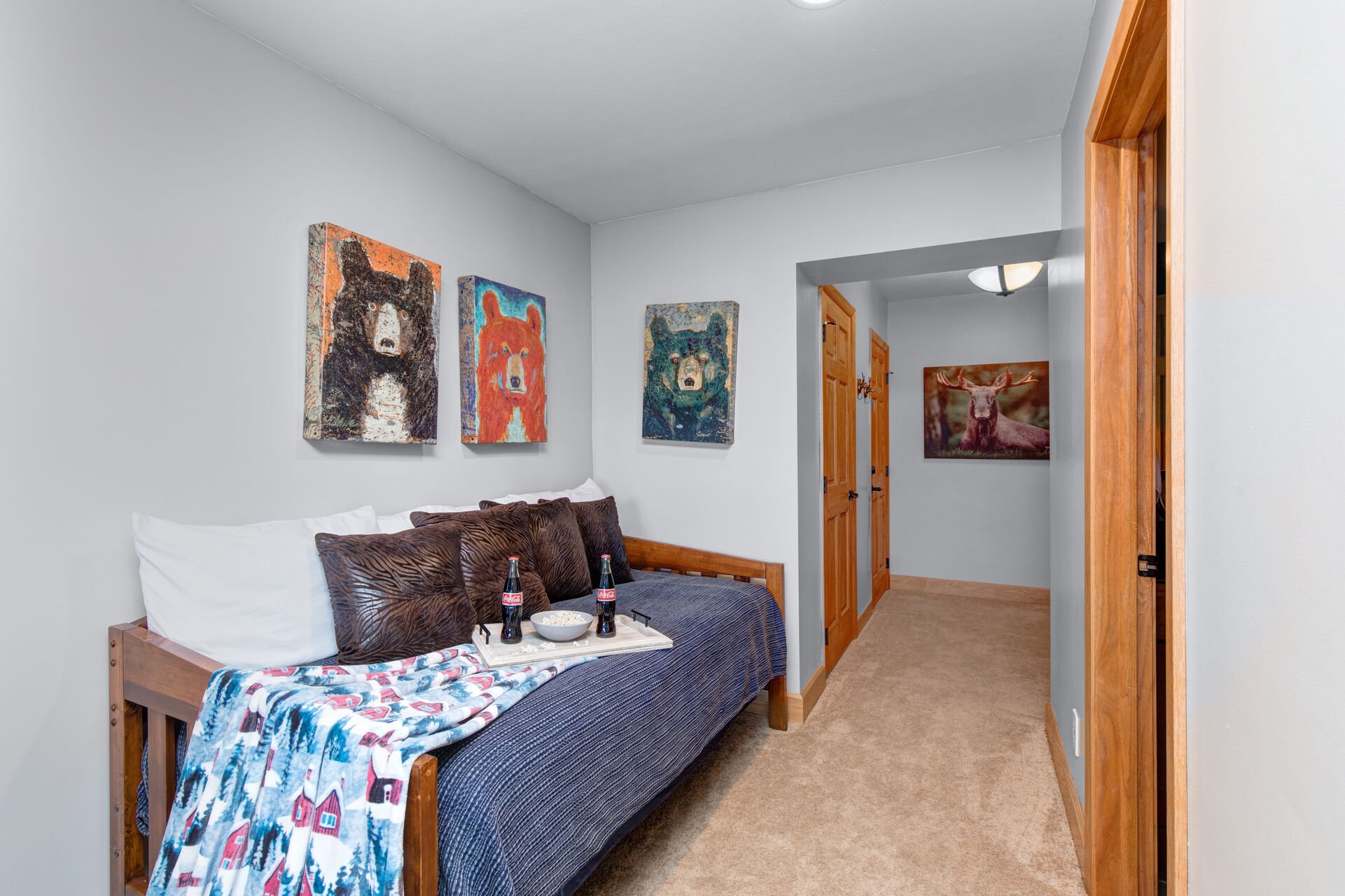 Entry Level Bedroom 3 with queen bed, twin over twin bunk bed, twin daybed, TV, patio access, and en suite bathroom