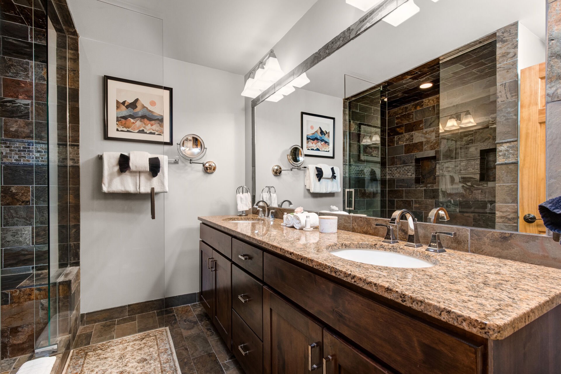 Master Bathroom with double sinks and stone & glass shower