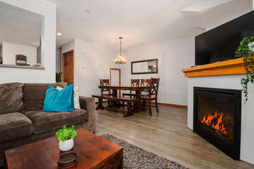 Dining area with gas fireplace and smart TV