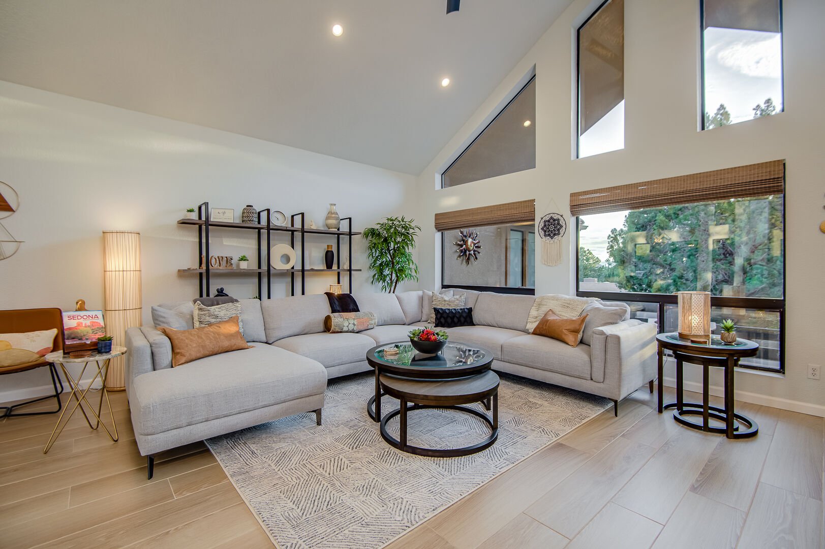 Living Room with High Ceilings and Large Windows and Offers a Cozy Sectional Sofa
