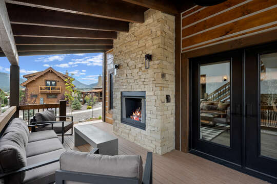 Outdoor patio with fireplace and private hot tub