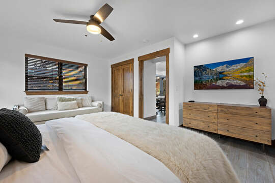 Main level master bedroom with attached private bathroom and 50 inch smart TV