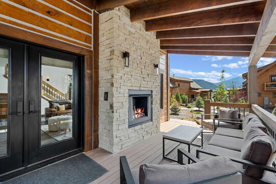 Outdoor patio with fireplace and private hot tub