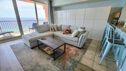 Living room with uninterrupted view of the Gulf. '02 stack is highly sought after at Shores!