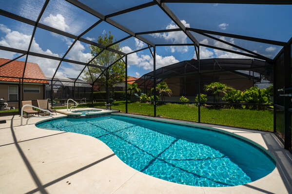 Beautiful enclosed pool with protective screen enclosure