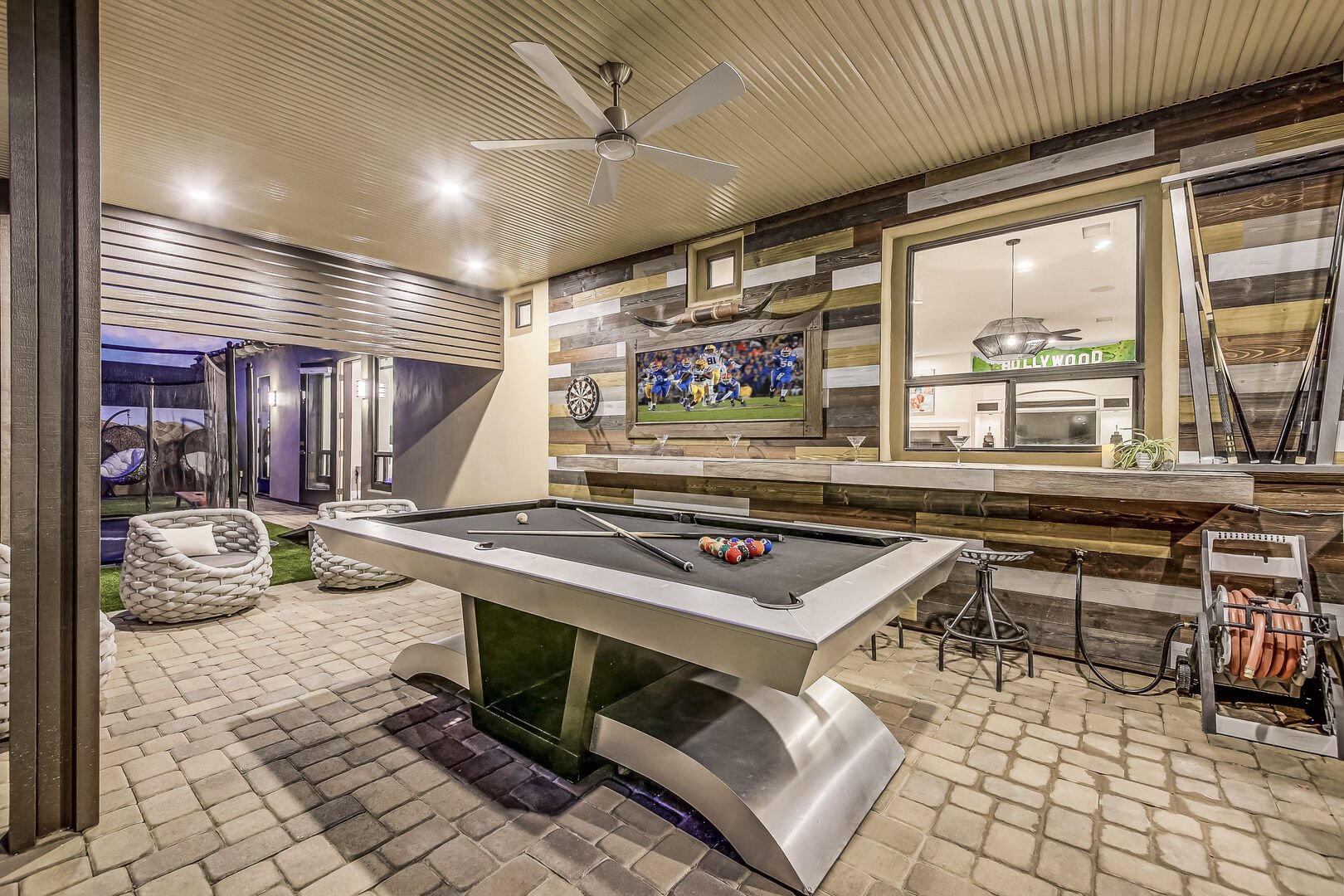 Enjoy a game on the pool table and stay cool under the remote-controlled ceiling fan.
