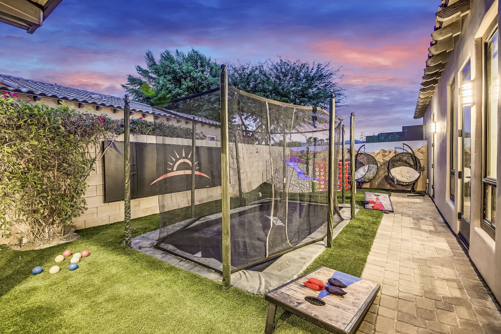 Enjoy more fun! Bocce ball, built-in trampoline, classic game of Bean Bag Toss, GIANT Connect 4, and seating for two on the modern hanging swing chairs.