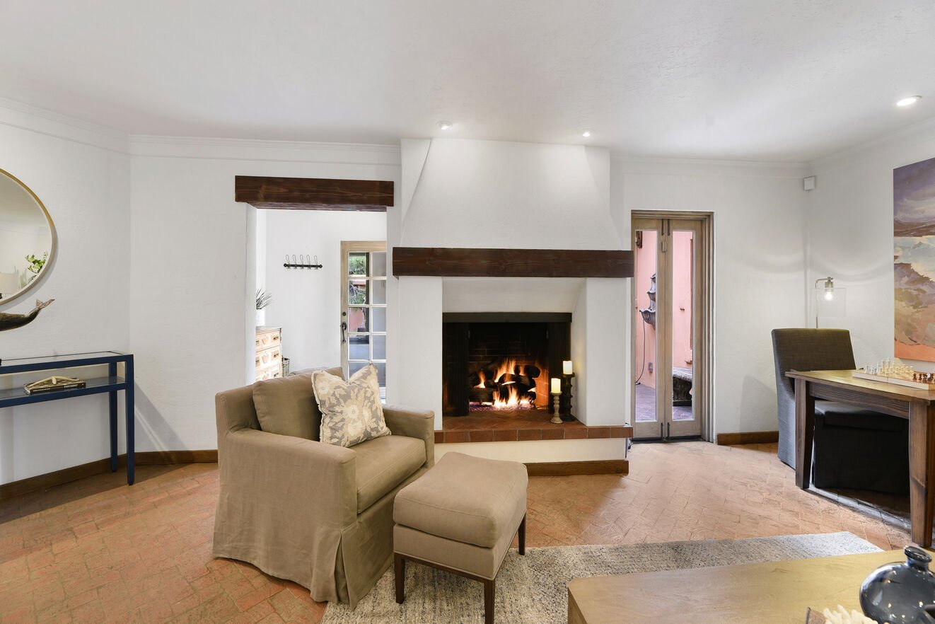 Living room with gas fireplace. Entry on the left.