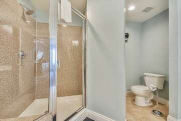 Master bathroom with double vanity, stand up shower and jetted bath tub