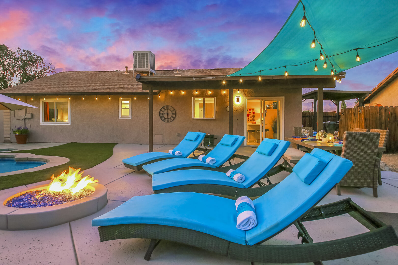 Let the kids enjoy their vacation in the pool while you watch from one of four lounge chairs around the natural gas fire pit.
