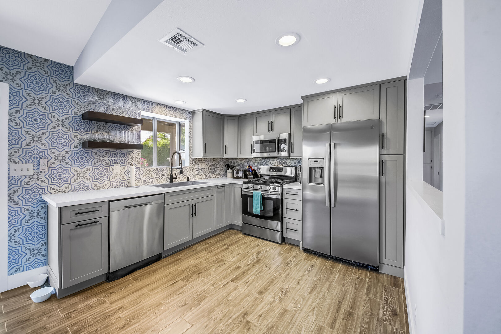 The fully-equipped kitchen features stunning stainless steel.