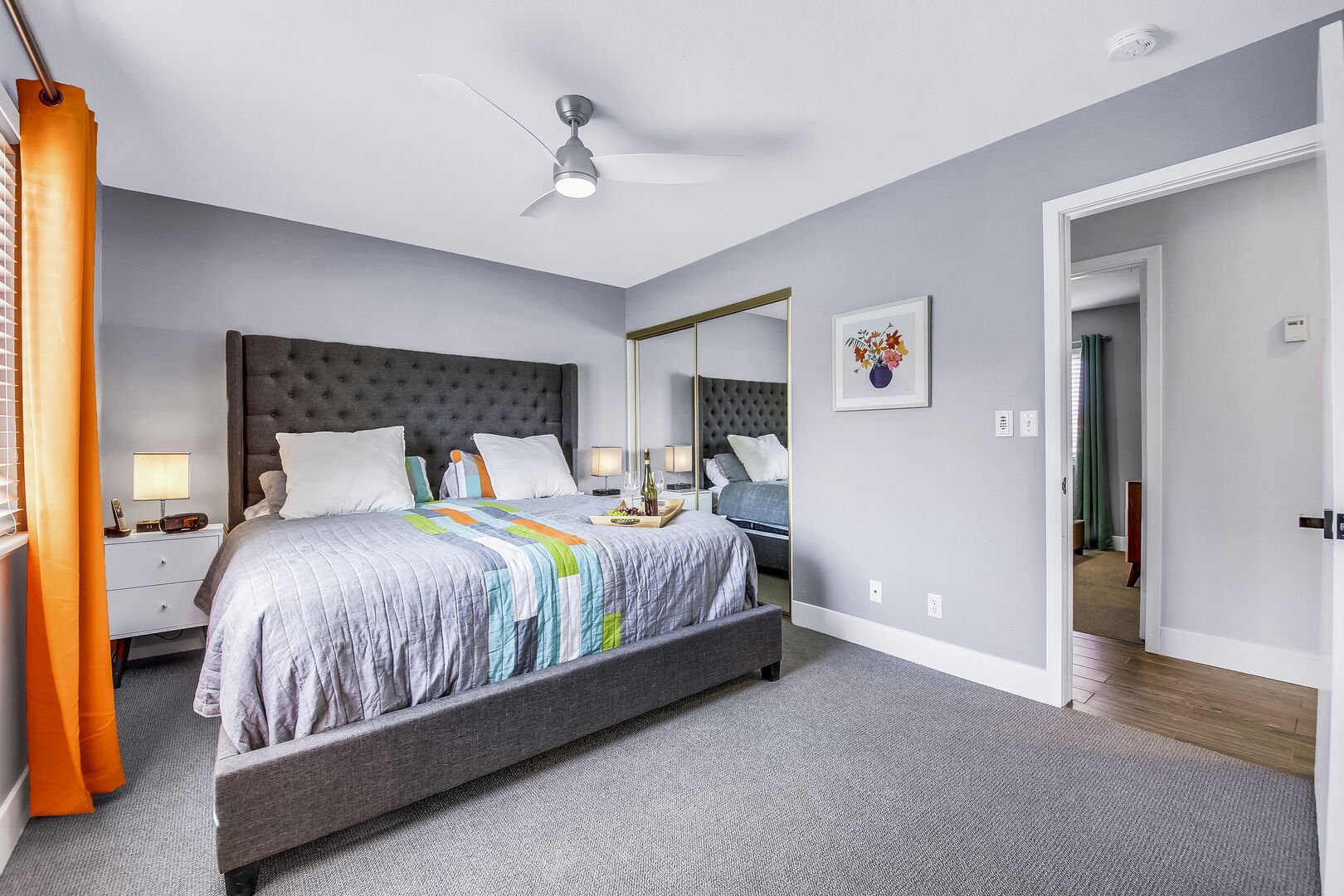 Master Suite 1 features a remote-controlled ceiling fan and  large reach-in closet.