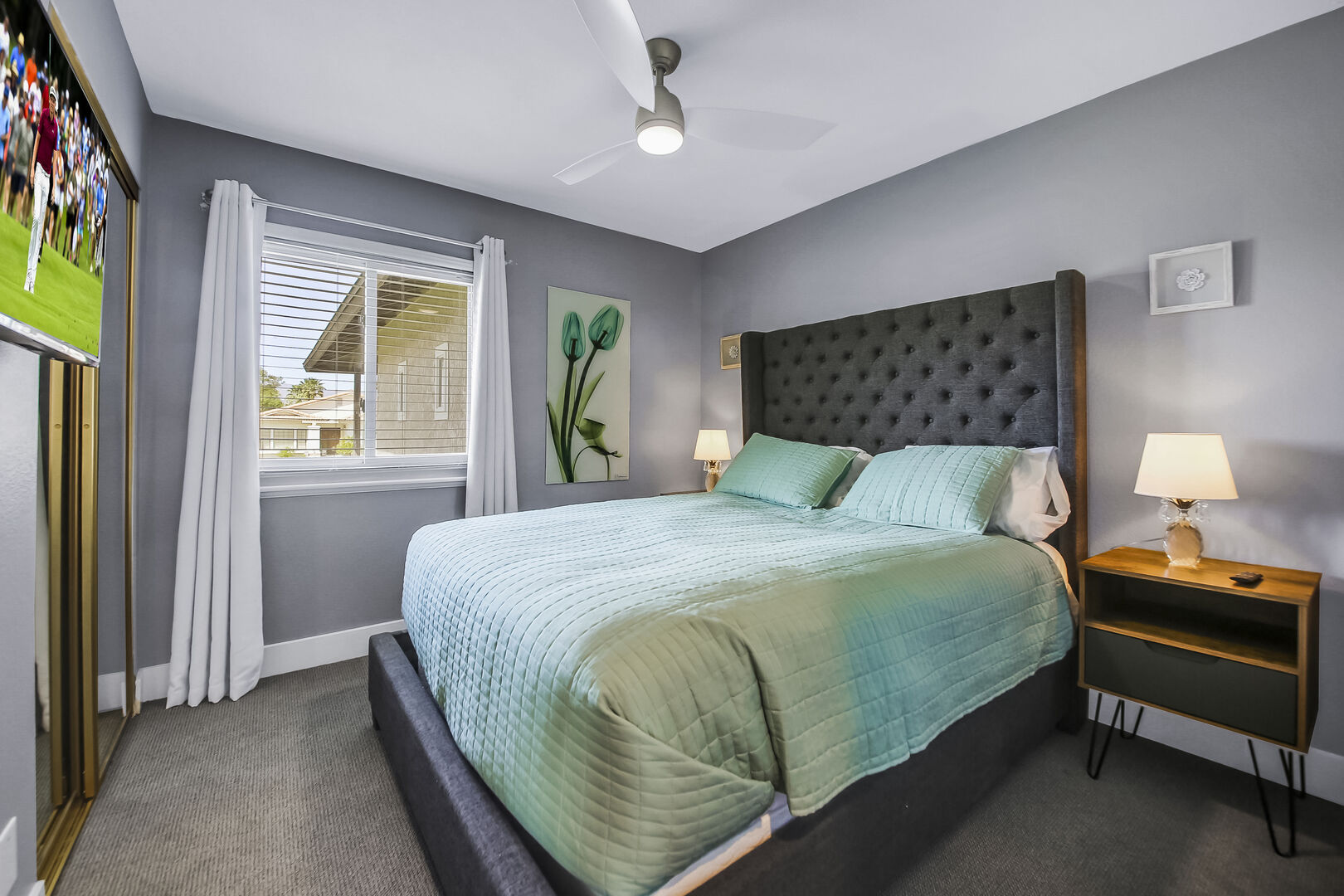 Bedroom 2 is located across from Master Suite 1 and features a King-sized Bed and a 41-inch Vizio Smart television.