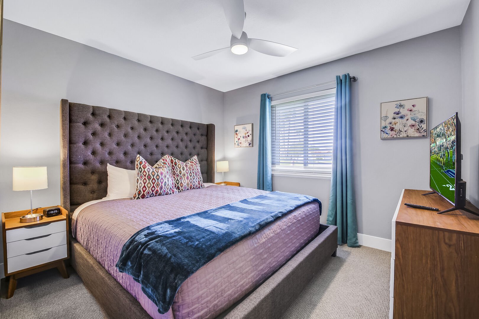 Bedroom 3 is located across the hallway bathroom and features a Queen-sized Bed and 41-inch Vizio Smart television.