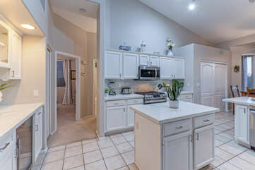 Modern appliances and generous counter space make working in the kitchen a delightful experience.