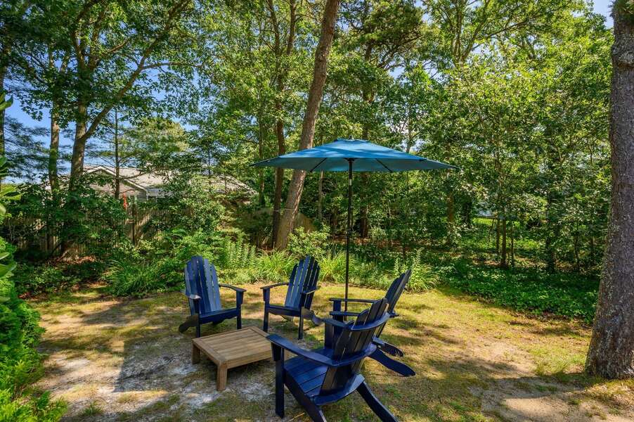 Evenings would be well spent sipping adult beverages in an Adirondack chair - 94 Joshua Jethro Road Chatham Cape Cod - Cape Escape - NEVR
