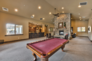 Jordanelle Clubhouse with fitness room, theatre room, full kitchen, billiards, gas fireplace, and outdoor pool and hot tub