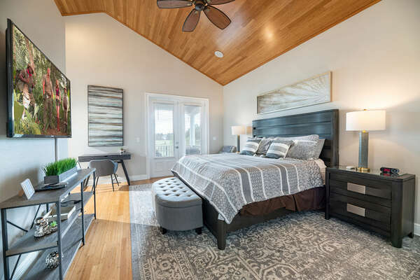 The master suite on the second floor features a king-sized and vaulted ceilings