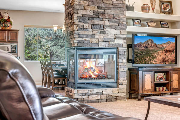 Cozy Living Room with a See-Through Gas Fireplace
