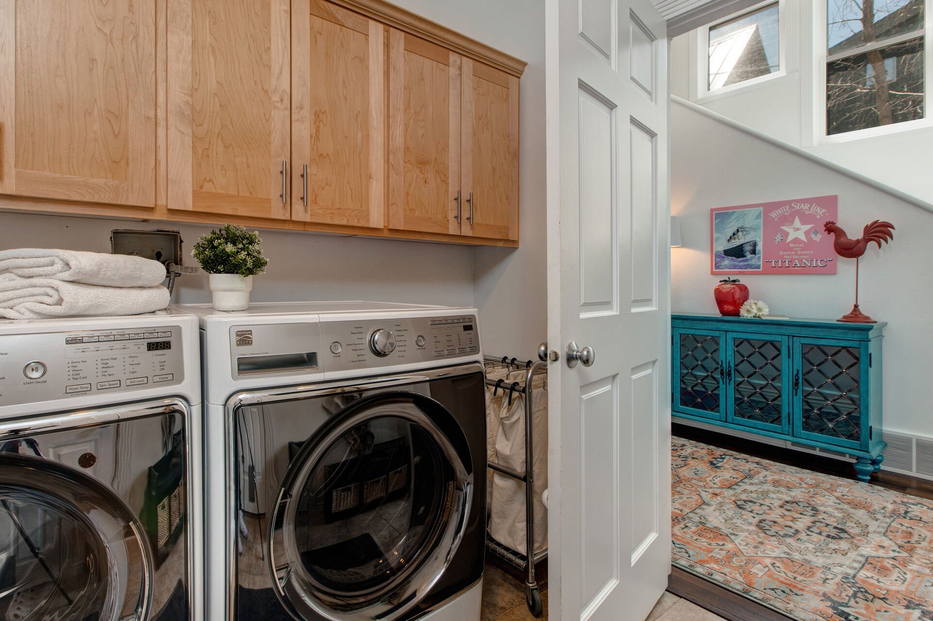 Main Level laundry room with full-sized washer and dryer