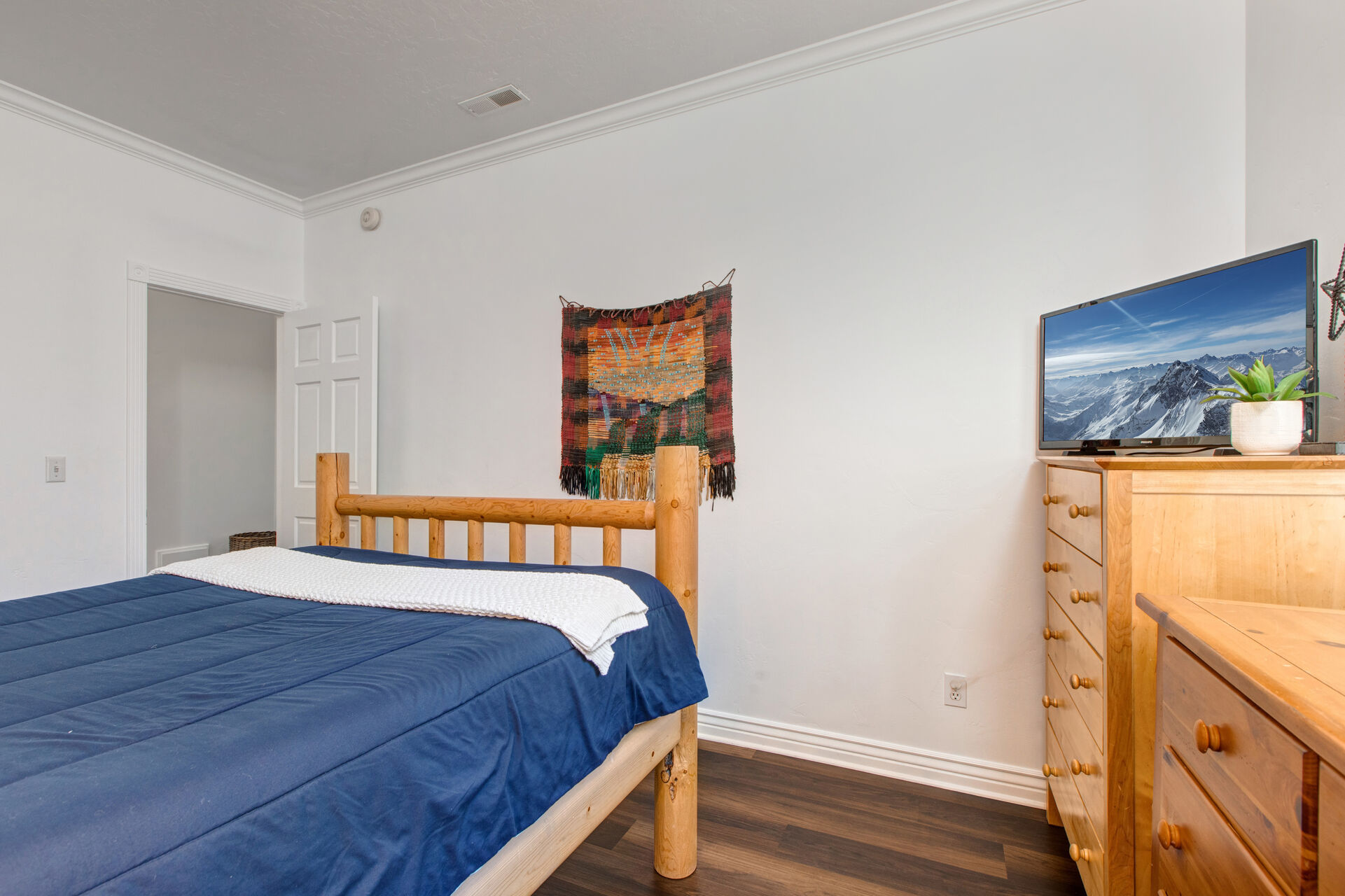 Bedroom 2 with queen bed, TV, and full bath access