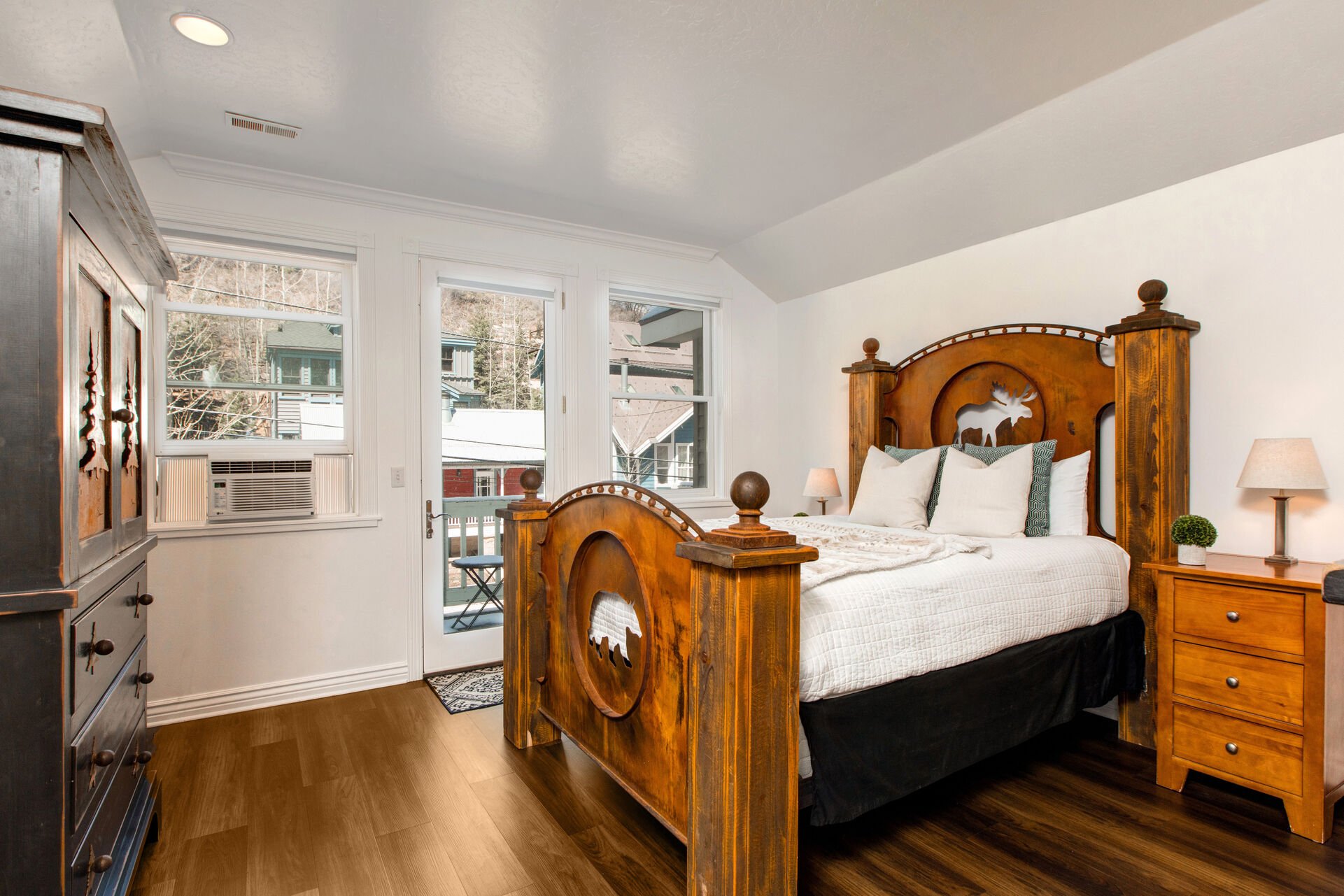 Master Bedroom with queen bed, tv, private balcony, and en suite bathroom