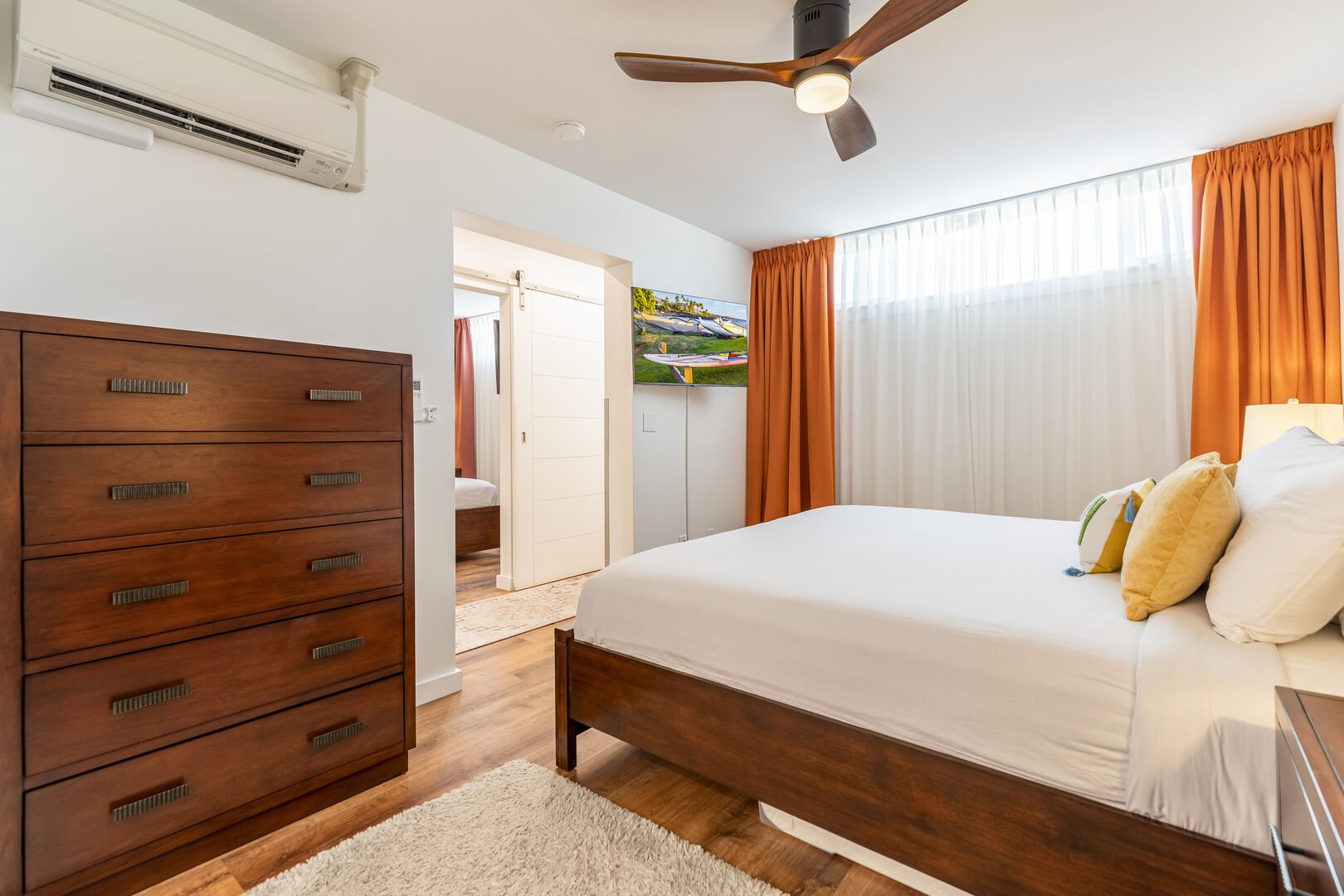 Master bedroom with split AC and ceiling fan