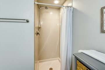 Stand up shower in the bathroom adjacent to bunk area