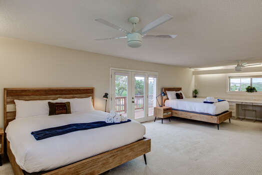 Bedroom 3 with one king bed and 1 queen bed and private deck