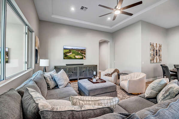 Living Room with Large Oversized Sectional and 62