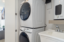 washer and dryer tuck away in a closet space