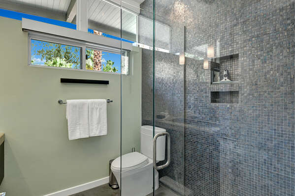SECOND FULL BATHROOM WITH GLASS SHOWER AND LARGE VANITY AND TILED WALL!