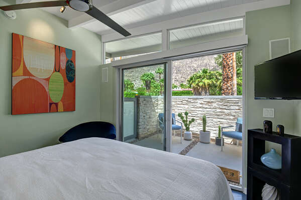SECOND BEDROOM WITH EXPANSIVE MOUNTAIN VIEWS AND PRIVATE OUTDOOR SEATING AREA