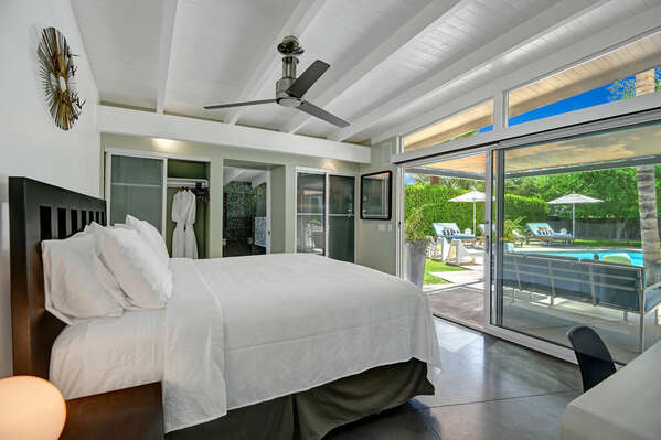 MASTER BEDROOM WITH SLIDER OPENING TO BACKYARD PARADISE
