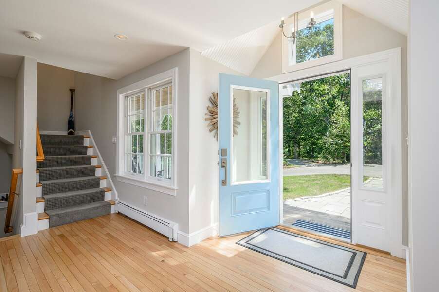 Entry with stairs to upper and lower level - 192 Great Marsh Rd Centerville Cape Cod